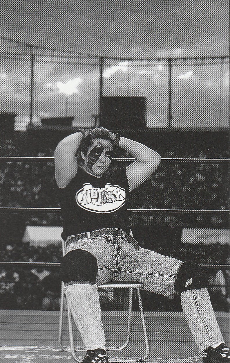 Shark Tsuchiya sitting on a steel chair inside the ring before her match