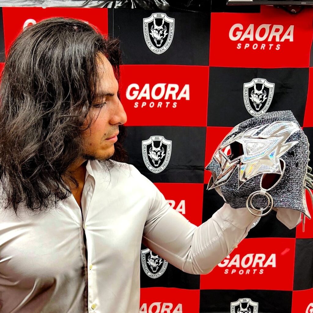 An image of Diamante gazing at his removed mask. He is very handsome.