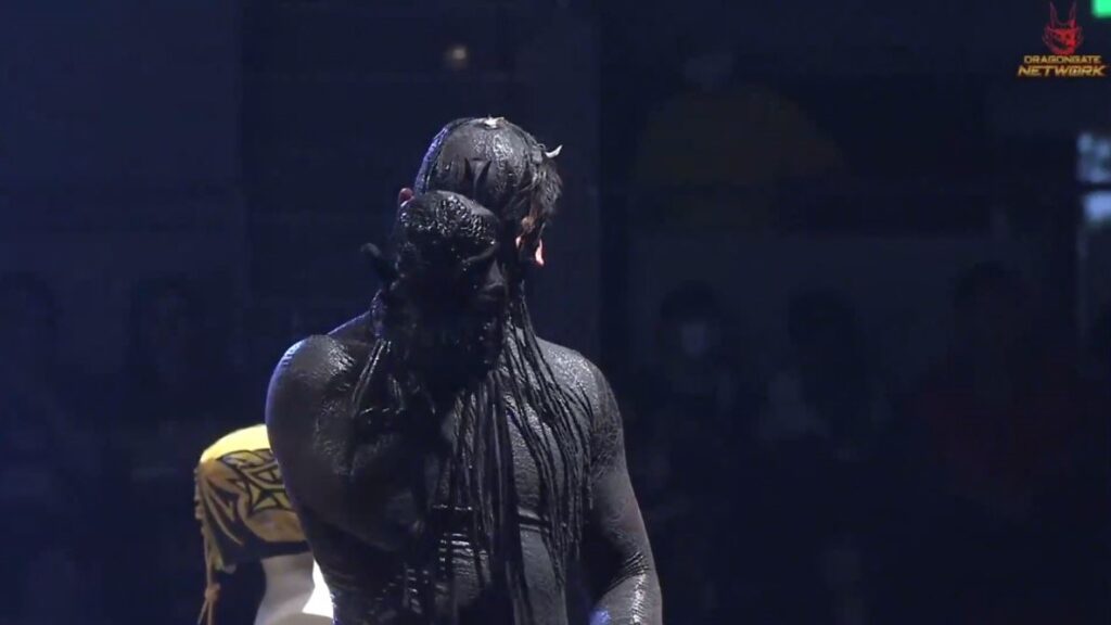 An image of Shun kissing his mask at the top of the cage